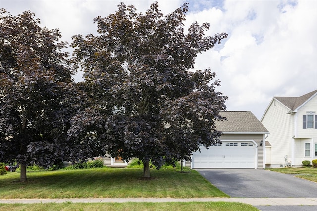 20 Parr Cir, Irondequoit, NY 14617 - view of front of property featuring driveway, a front lawn, an attached garage, and a shingled roof