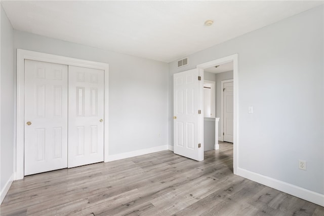 20 Parr Cir, Irondequoit, NY 14617 - unfurnished bedroom with light wood-style flooring and a closet