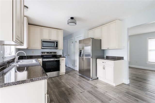 20 Parr Cir, Irondequoit, NY 14617 - kitchen featuring appliances with stainless steel finishes, light wood-style floors, and healthy amount of natural light