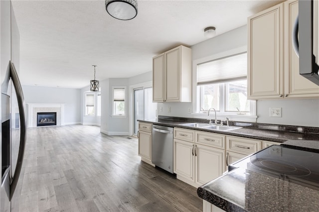 20 Parr Cir, Irondequoit, NY 14617 - kitchen with cream cabinetry, appliances with stainless steel finishes, healthy amount of natural light, and wood finished floors
