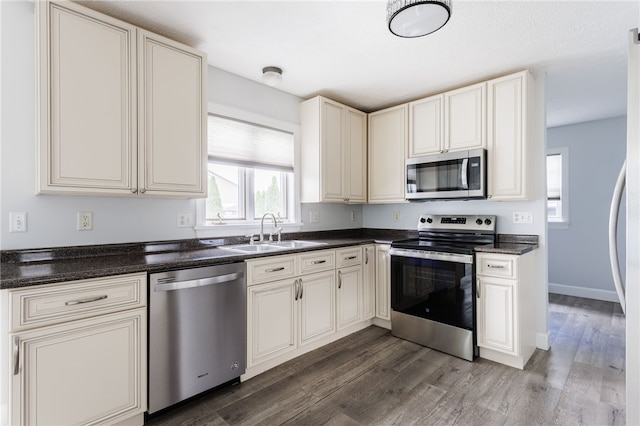 20 Parr Cir, Irondequoit, NY 14617 - kitchen featuring stainless steel appliances, dark countertops, and dark wood-type flooring