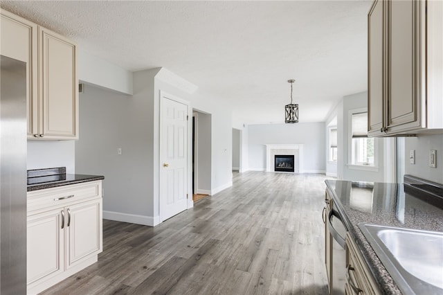 20 Parr Cir, Irondequoit, NY 14617 - kitchen featuring wood finished floors, appliances with stainless steel finishes, open floor plan, and cream cabinetry