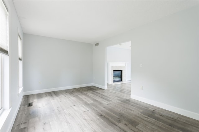 20 Parr Cir, Irondequoit, NY 14617 - unfurnished living room with wood finished floors and a tiled fireplace