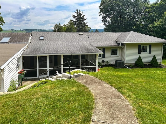 3265 Reading Rd, Reading, NY 14891 - back of house featuring a sunroom, a shingled roof, and a yard