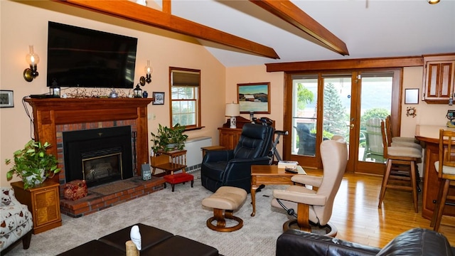 3265 Reading Rd, Reading, NY 14891 - living room with wood finished floors, a fireplace, french doors, and beam ceiling