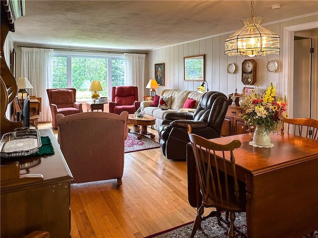 3265 Reading Rd, Reading, NY 14891 - living area with light wood-style floors, a chandelier, and ornamental molding
