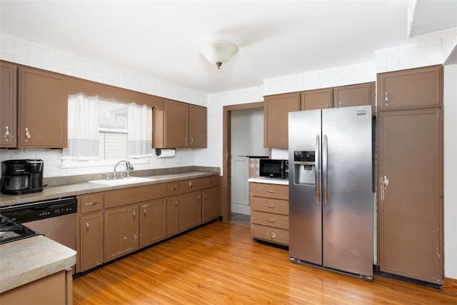 269 Michael Ave, Cheektowaga, NY 14212 - kitchen featuring appliances with stainless steel finishes, light wood-type flooring, and backsplash