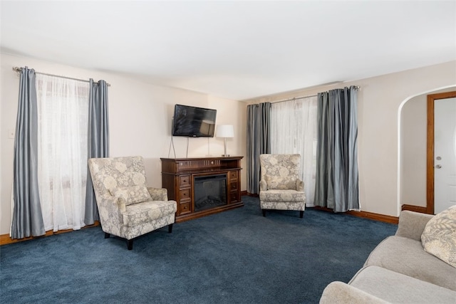 269 Michael Ave, Cheektowaga, NY 14212 - living area with a glass covered fireplace, arched walkways, and carpet flooring