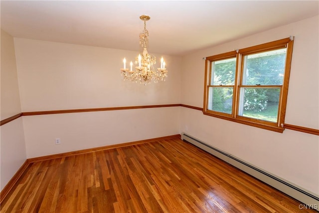 209 Pear Tree Dr, Camillus, NY 13031 - empty room with baseboard heating, wood finished floors, and a chandelier
