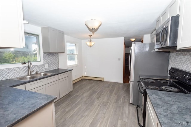 209 Pear Tree Dr, Camillus, NY 13031 - kitchen featuring black / electric stove, dark countertops, stainless steel microwave, and backsplash