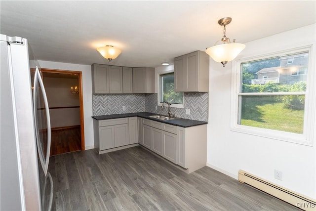 209 Pear Tree Dr, Camillus, NY 13031 - kitchen featuring freestanding refrigerator, a baseboard radiator, gray cabinetry, and dark countertops