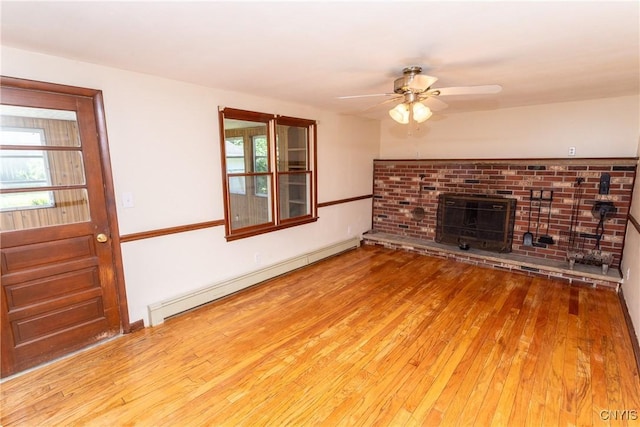 209 Pear Tree Dr, Camillus, NY 13031 - unfurnished living room with a baseboard radiator, ceiling fan, hardwood / wood-style floors, and a brick fireplace