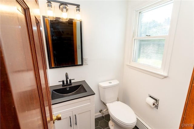 209 Pear Tree Dr, Camillus, NY 13031 - bathroom with vanity, baseboard heating, and tile patterned floors
