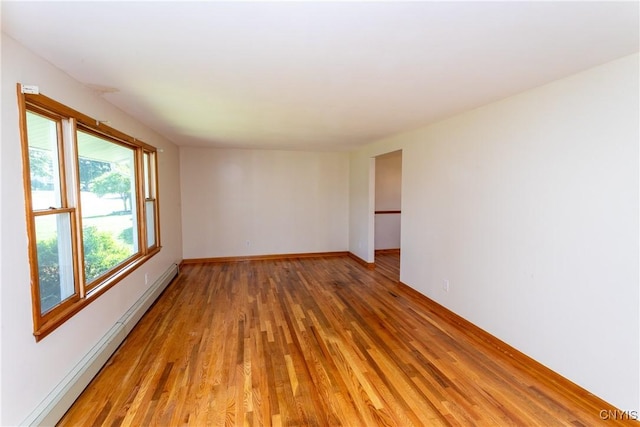 209 Pear Tree Dr, Camillus, NY 13031 - unfurnished room featuring a baseboard radiator and light wood-type flooring