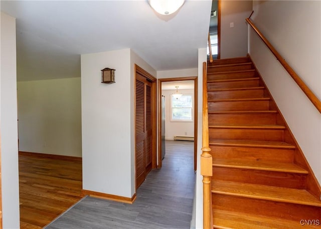 209 Pear Tree Dr, Camillus, NY 13031 - stairs featuring wood finished floors and baseboard heating