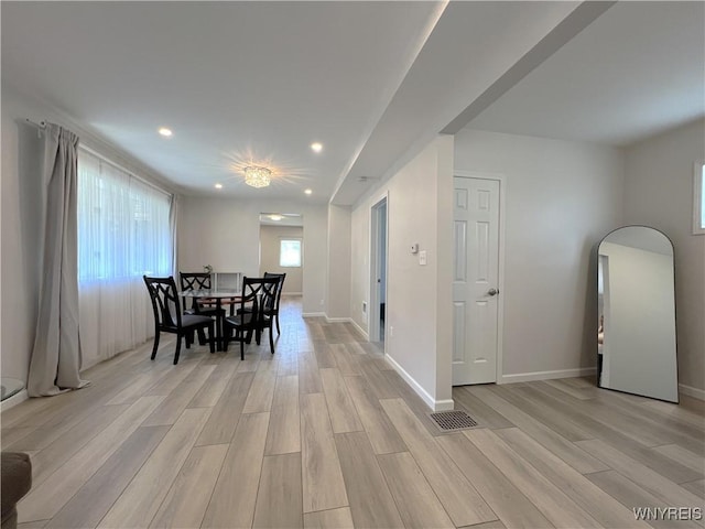 42 Argus St, Buffalo, NY 14207 - dining space featuring light wood-style floors, recessed lighting, and arched walkways