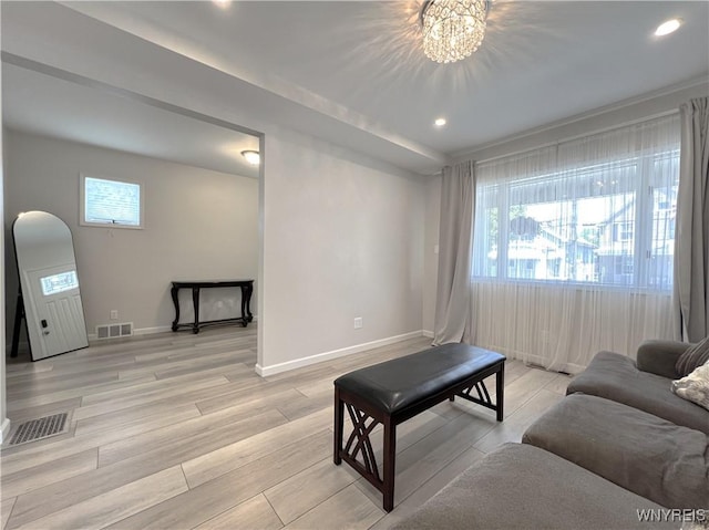 42 Argus St, Buffalo, NY 14207 - living room featuring plenty of natural light, light wood-style flooring, recessed lighting, and a chandelier