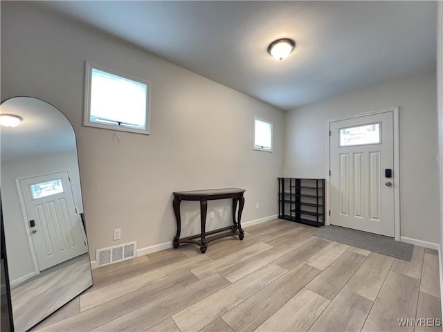 42 Argus St, Buffalo, NY 14207 - foyer entrance with light wood-style floors and arched walkways