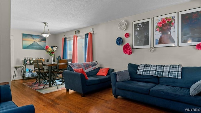 46 Alexander Ave, Cheektowaga, NY 14211 - living area with wood finished floors and a textured ceiling