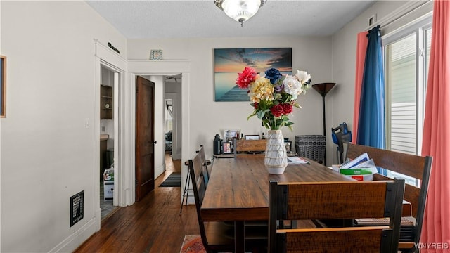 46 Alexander Ave, Cheektowaga, NY 14211 - dining room featuring wood finished floors and a textured ceiling