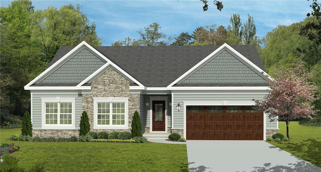 view of front of property with a front yard and a garage