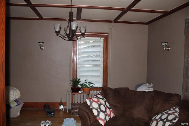 living room with hardwood / wood-style floors and a chandelier