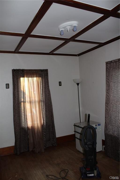 miscellaneous room with coffered ceiling and dark wood-type flooring