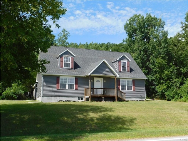 cape cod house with a front lawn