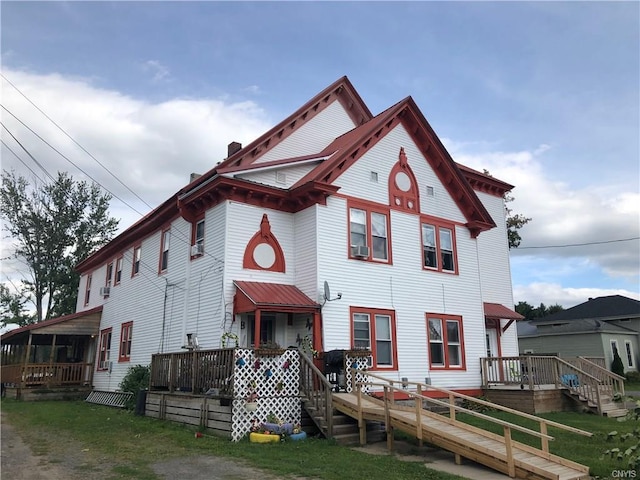 victorian home with a deck