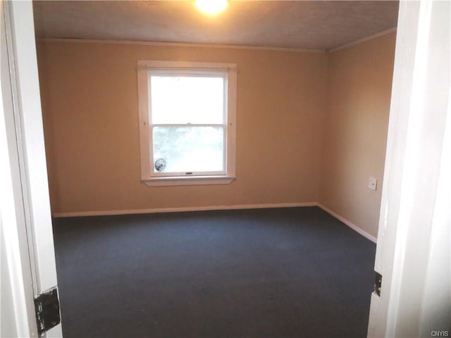 unfurnished room featuring dark colored carpet