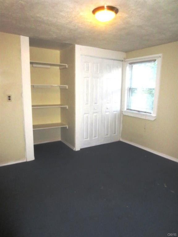 unfurnished bedroom with a closet