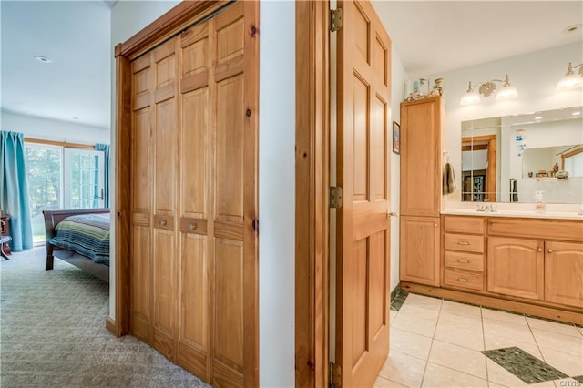 bathroom with tile floors and vanity