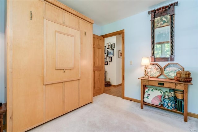 interior space featuring light colored carpet