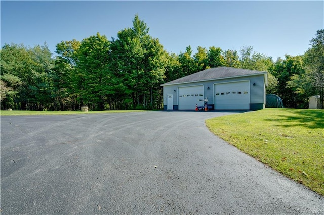 garage with a lawn