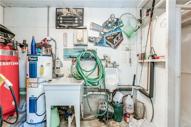 utility room featuring water heater