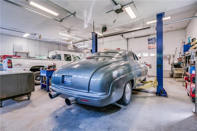 garage featuring a garage door opener and ceiling fan