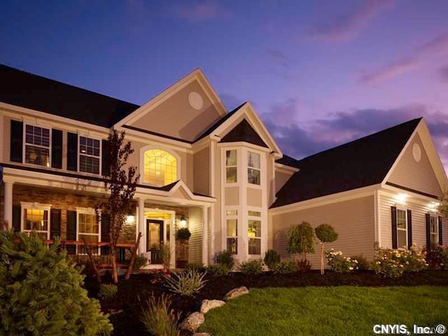 view of front of property with a lawn