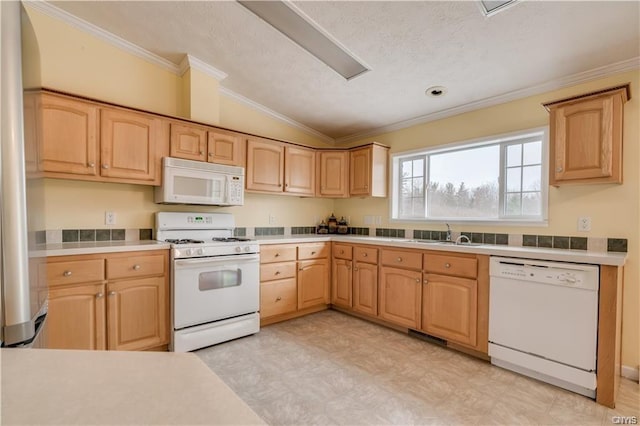 kitchen with lofted ceiling, white appliances, light tile floors, light brown cabinetry, and crown molding