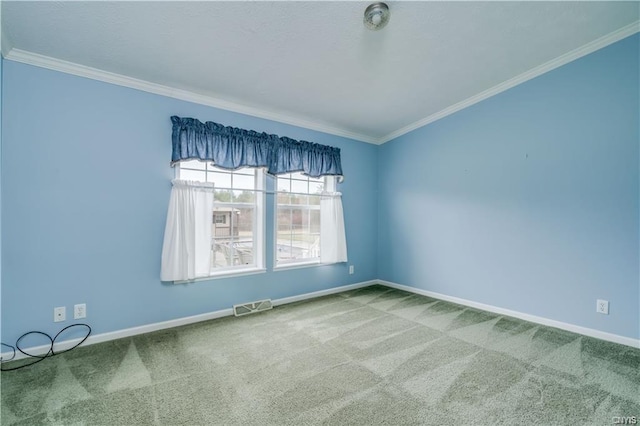 unfurnished room with carpet floors and crown molding