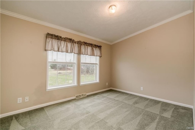 carpeted empty room featuring ornamental molding