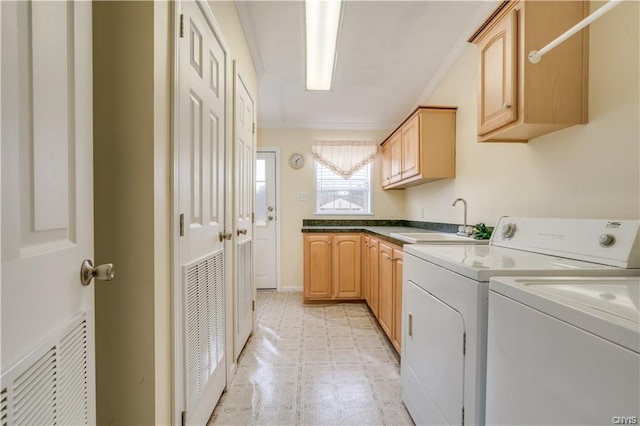 washroom with light tile flooring, cabinets, ornamental molding, independent washer and dryer, and sink