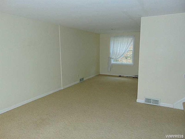 spare room with light carpet