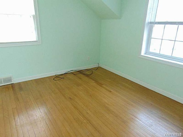 interior space featuring light wood-type flooring and a healthy amount of sunlight