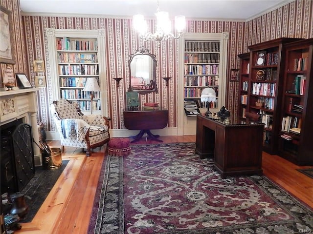 office featuring a chandelier, dark wood-type flooring, and crown molding