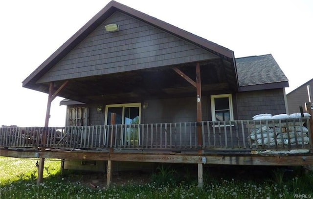 back of house featuring a wooden deck