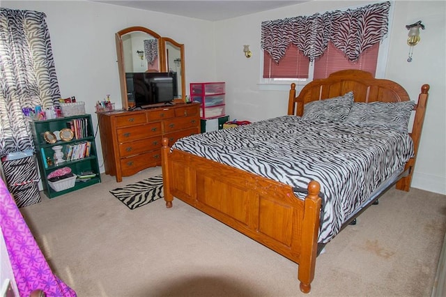 bedroom featuring light carpet