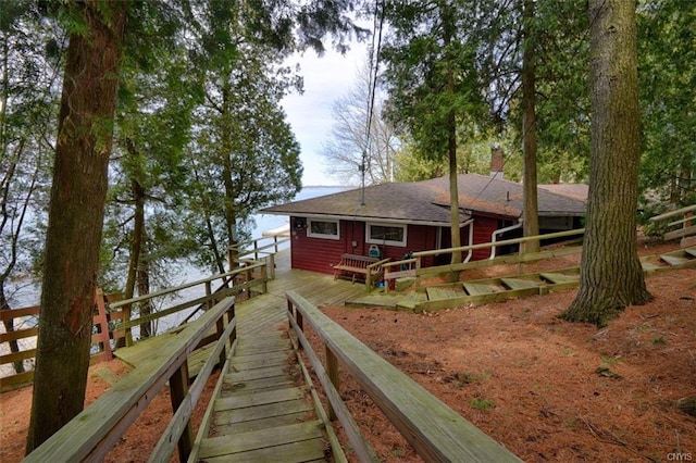 rear view of property with a deck