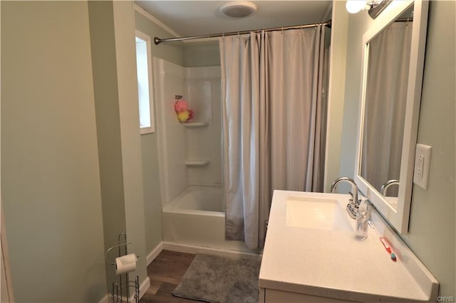 bathroom featuring shower / bath combo, wood-type flooring, and vanity