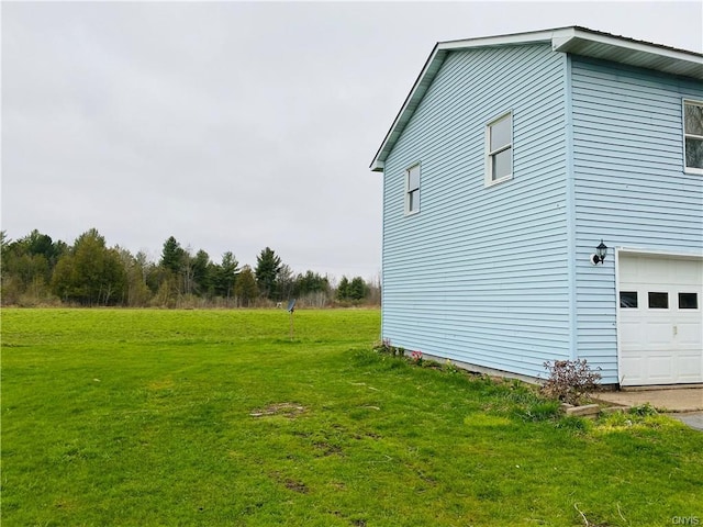 view of home's exterior with a yard