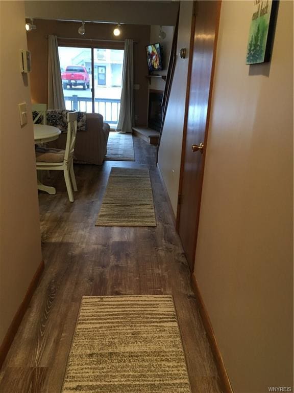 hall featuring dark wood-type flooring